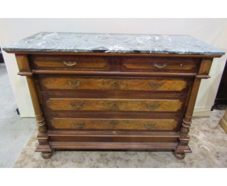 A 19th century walnut commode with decorative green, black, grey and white marble top over two short and three long drawers w