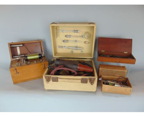 A collection of therapy machines to include interesting leather clad box, the hinged lid enclosing two dials and a hose and v