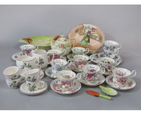A collection of Royal Albert Flower of the Month series teawares including eleven cups, eleven saucers and two tea plates, to
