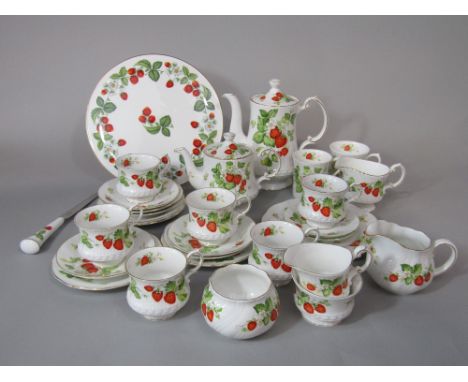 A collection of Queen's Virginia Strawberry pattern wares comprising coffee pot, tea pot, three milk or cream jugs, two sugar