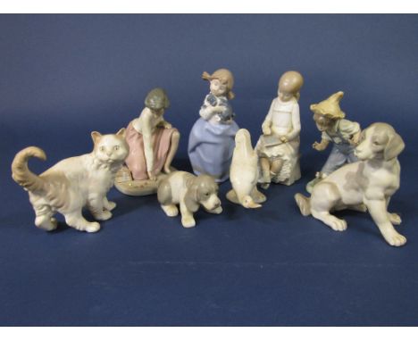 A collection of Nao figures of children including girl playing marbles, girl with a slate, etc, together with a Nao dog, cat 