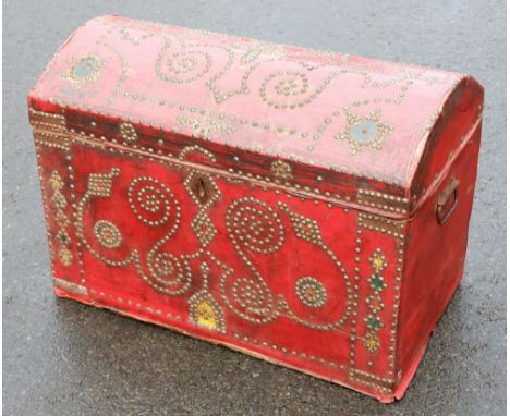 A travelling trunk with domed lid in pine, overlaid with red oil cloth and decorative stencil work detail, 80cm wide