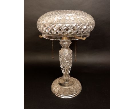 Possibly Waterford, cut glass twin branch table lamp, the domed shade over a hob nail cut column upon a star cut circular bas