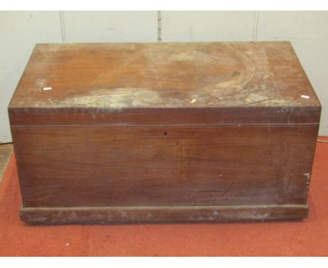 A 19th century teakwood travelling trunk of sturdy construction with bass carrying handles, 100cm wide