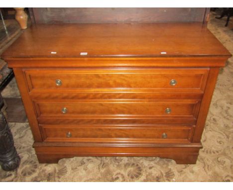 A contemporary French cherrywood commode of three long drawers with moulded detail and bracket supports, 112cm wide