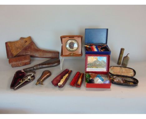 Small miscellaneous collection including cigarette holders, powder flasks, 1910 US military leather holster and 1906 bullet c