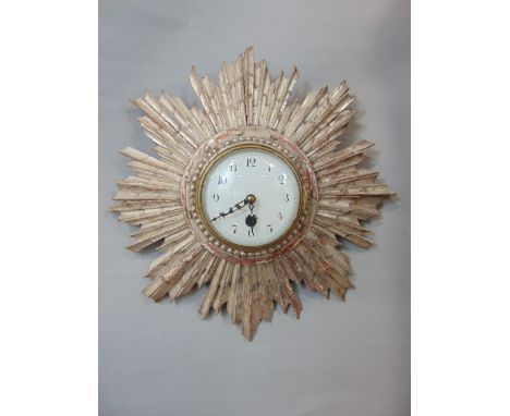 19th century gesso sunburst wall clock converted to quartz, the convex enamel dial with roman numerals, 36cm diameter