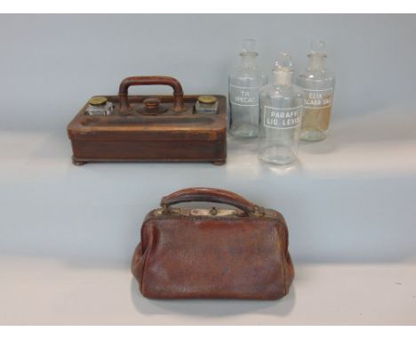 A mixed lot to include three glass apothecary jars, a miniature gladstone bag by Holme and a twin desk standish with two pen 