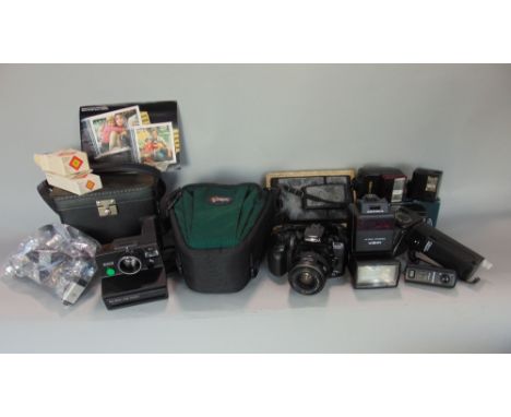 A bag containing a Minolta Dynax camera c/w zoom lens and two other boxes of mixed photographic items to include a Polaroid S