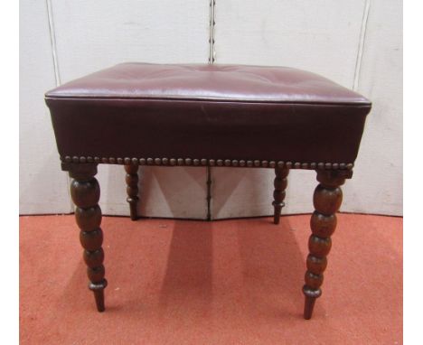 A centre stool raised on four turned and tapering bobbin moulding rosewood supports, with buttoned maroon leather top, 46cm m