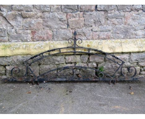 A heavy exterior ironwork frame with scrollwork detail, to house a crescent shaped sign, approx 170cm long x 62cm high (full 