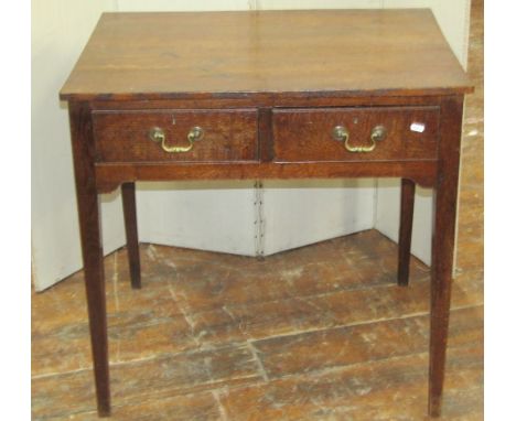 A Georgian oak side table enclosing two frieze drawers, raised on square cut supports, 80cm wide