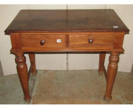 A hardwood side table fitted with two frieze drawers, raised on four turned tapered legs, partially united by stretchers, 3ft