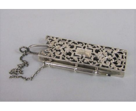 Victorian silver notebook sleeve and pencil, pierced with scrolled foliate decoration, maker J W, Birmingham 1888, 8cm long