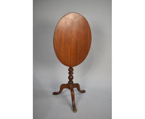 An Edwardian Mahogany Oval Snap Top Tripod Table with Bobbin Supports, 57cms High 