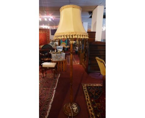A 20th Century oak standard lamp