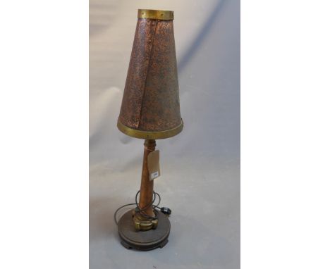 A 1960's copper 'Fire Hydrant' table lamp, having fire bucket shade above five hose nozzle on circular wooden base, H:94cm 