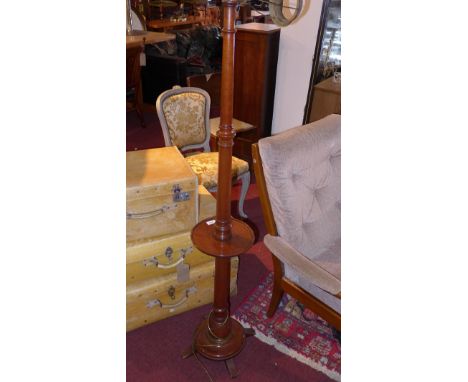 An early 20th Century turned mahogany standard lamp. 