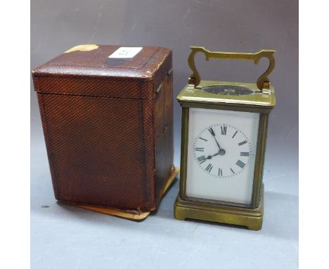 A 20th Century brass carriage clock, the white enamel dial with Roman numerals and outer minute tracks, raised on bracket sup