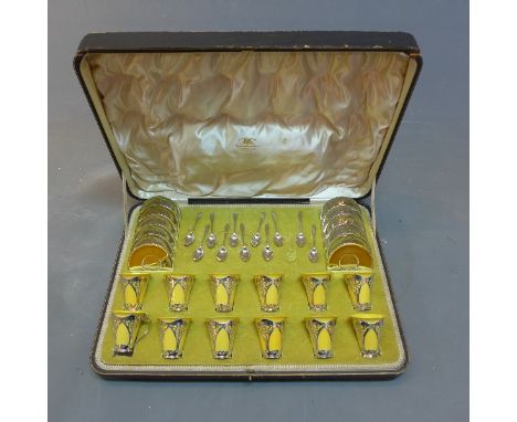 An Art Nouveau Goldsmiths and Silversmiths Company silver tea set comprising of 12 saucers, 11 spoons and 12 cups with Royal 