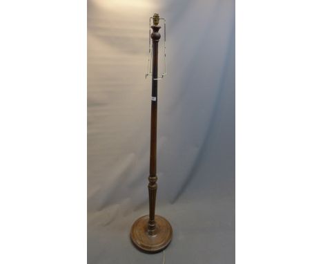 An early 20th Century oak standard lamp