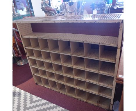 A Vintage steel post office pigeon hall cabinet having forty shelves, H:106cm W:123cm D:28cm  