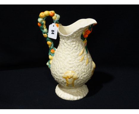     A Clarice Cliff Newport Pottery Celtic Harvest Pattern Milk Jug, (AF)           