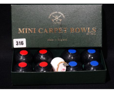     A Boxed Set Of Vintage Carpet Bowls                                             