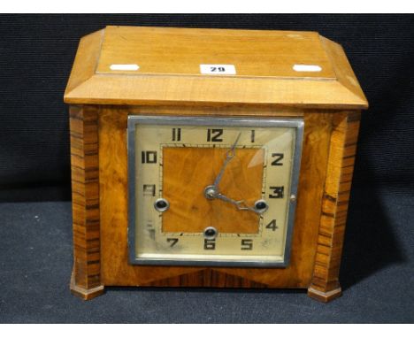     An Art Deco Period Wood Veneer Encased Mantel Clock                             