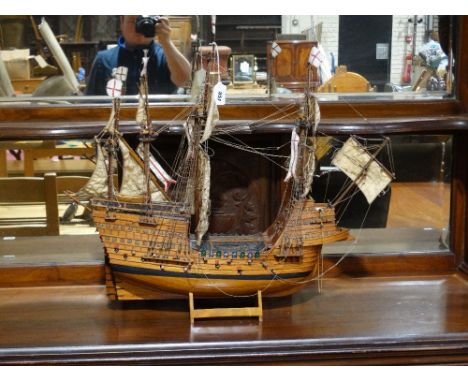     A Scale Model Galleon On A Stand                                                