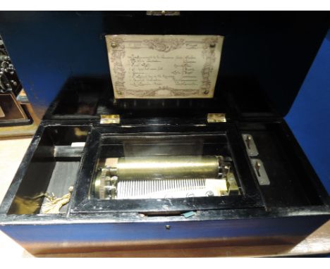A late 19th Century music box, in mahogany and ebonised case, playing 8 airs, hand written label, movement numbered 3727CONDI