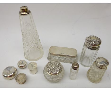 Collection of Edwardian silver topped dressing table jars, silver pill box, silver lids etc  Condition Report Click here for 