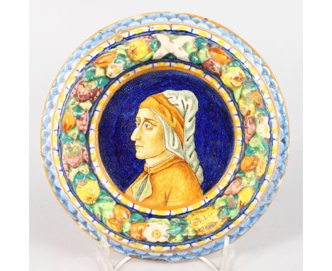 A GOOD ITALIAN FAIENCE CIRCULAR PORTRAIT PLAQUE, the colourful border with fruit.  7ins diameter.