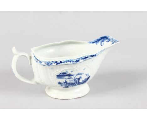 AN 18TH CENTURY WORCESTER SAUCEBOAT, painted with the 'uncommon' Fisherman and Billboard Island pattern in underglaze blue.