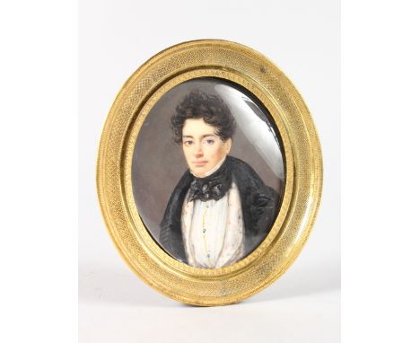 VICTORIAN SCHOOL (CIRCA 1840-1850). Portrait half length of a young man wearing a black coat. 8cms x 7cms in a superb gilt ov