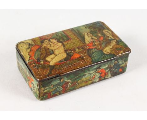 AN 18th CENTURY PERSIAN PAPIER MACHE SNUFF BOX with erotic and other scenes. 9.5cms long.