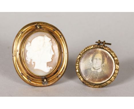 A VICTORIAN CAMEO BROOCH and a small portrait pendant (2).