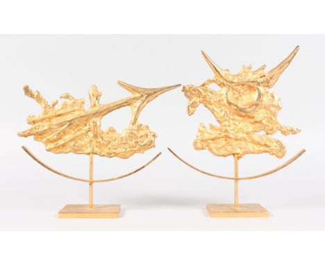 A MATCHED PAIR OF ORMOLU ARROW SCULPTURES. Stamped C.H., on a pedestal base.  9.5ins high.