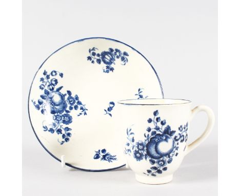 AN 18TH CENTURY WORCESTER COFFEE CUP AND SAUCER printed with sprigs of fruit in underglaze blue.