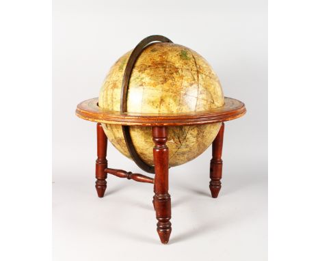 AN EARLY 19th CENTURY TERRESTRIAL GLOBE on a turned wood stand. 16ins high.