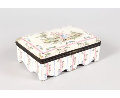 AN 18th CENTURY FRENCH TIN GLAZE BOX AND COVER, the lid with a man and woman, the woman playing a mandolin. 6.5ins long.