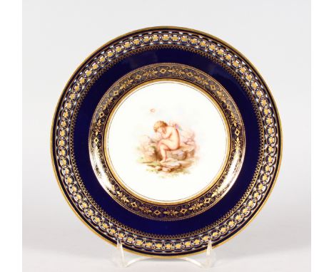 A MEISSEN BLUE PLATE WITH COBALT BLUE GROUND AND OPENWORK BORDER decorated with intricate patterns of gilding, the central pa