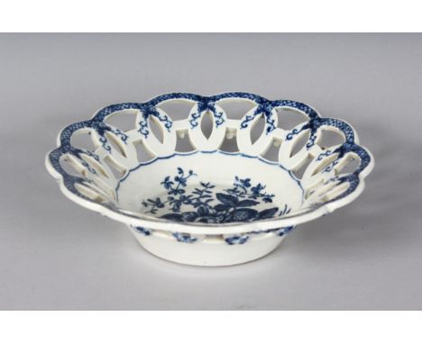 A WORCESTER BLUE AND WHITE CIRCULAR PIERCED DISH, crescent mark in blue. 7.5ins diamter.