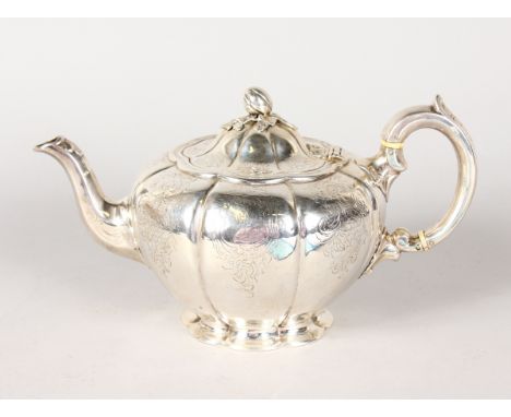 A VICTORIAN ENGRAVED MELON SHAPED TEAPOT AND COVER with melon finial. London 1843. Maker: J. S. AND A. S. Weight 18ozs.