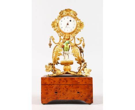 A SUPERB SMALL MUSICAL BOX CLOCK. Inset with a Verge watch movement by LANDRY A PARIS and porcelain bird, the Swiss musical b
