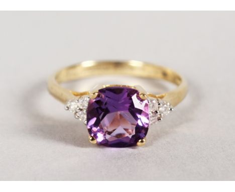 A 9CT GOLD AMETHYST AND DIAMOND RING.