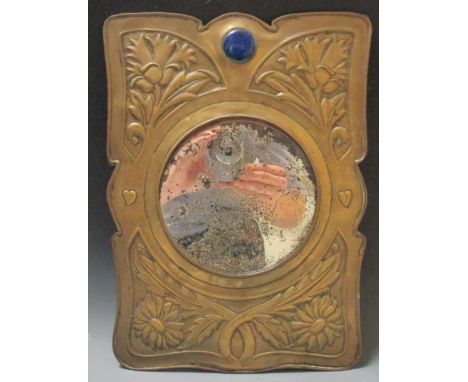 An Arts and Crafts brass mirror with a blue enamel roundel, 34 x 24cm  