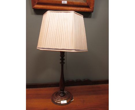 A table lamp, of turned stem and circular base, with shade  