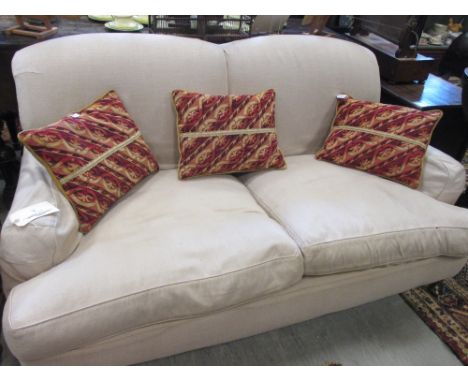 A Howard style cream upholstered low sofa  