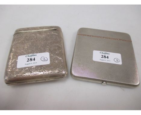 An Edwardian silver cigarette case by Boots Pure Drug Company, Birmingham 1901, rectangular with hinged cap and front cover, 